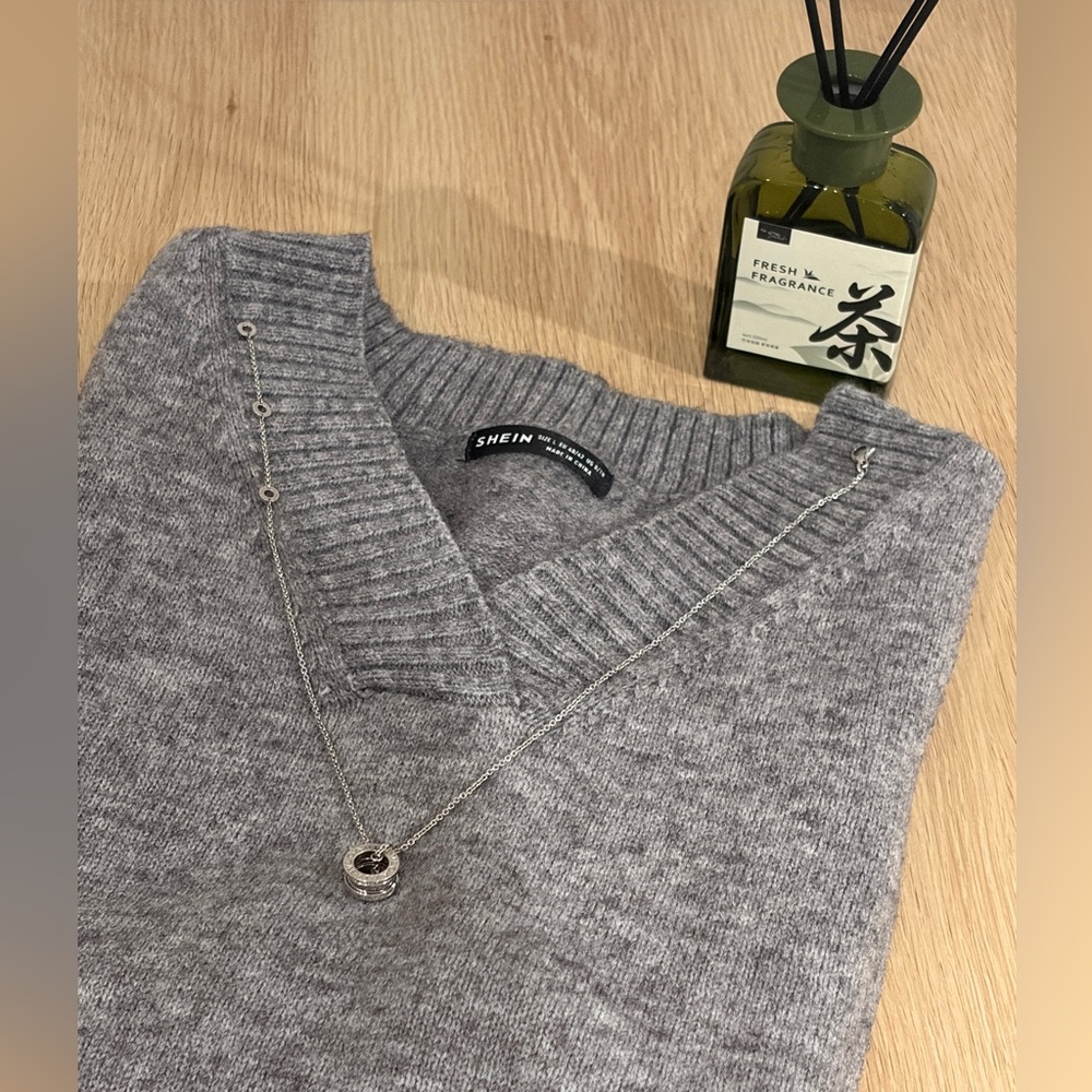 grey v-neck sweater vest